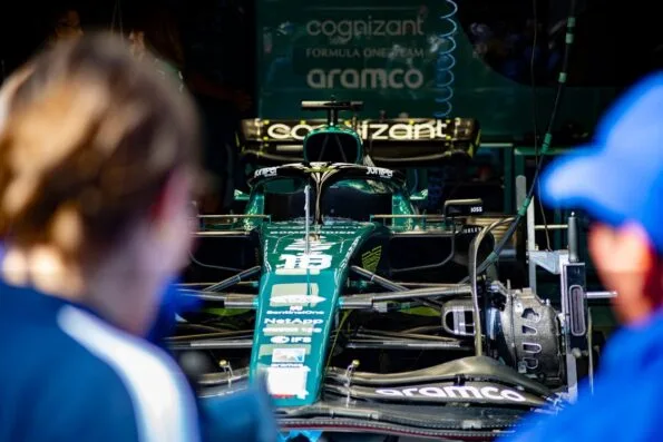 F1 driver race suit combining safety features and sleek precision-driven design