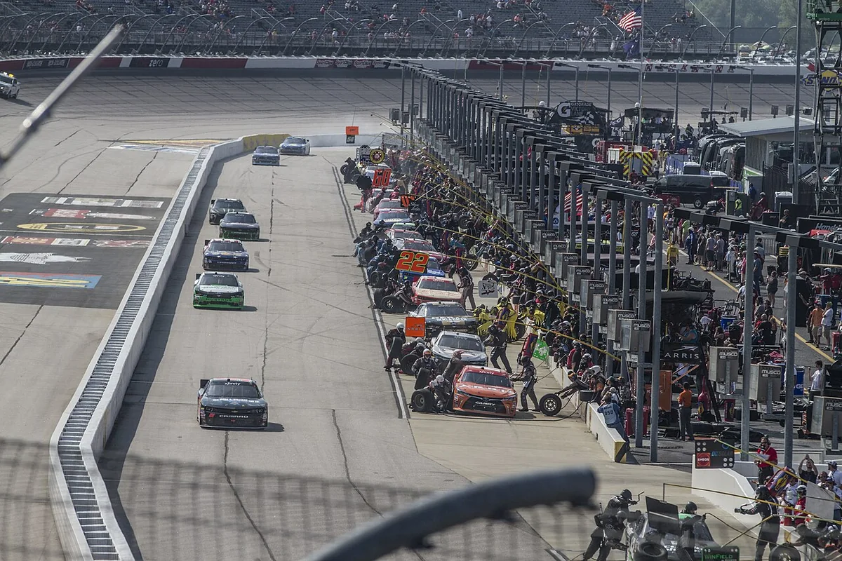 NASCAR teams servicing multiple cars in the Darlington Raceway pit lane