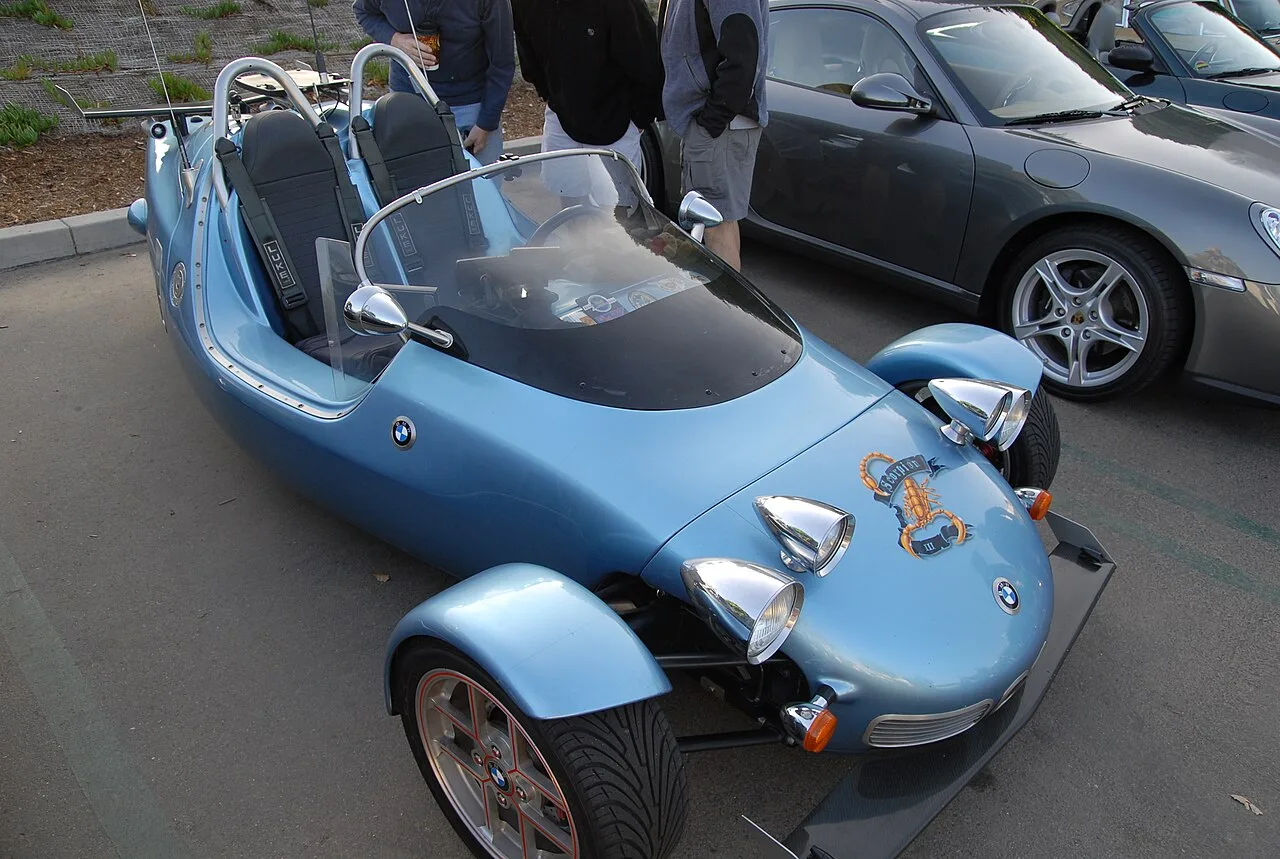 Enthusiasts and their cars at a Cars and Coffee meet, the world behind car-guy gifts