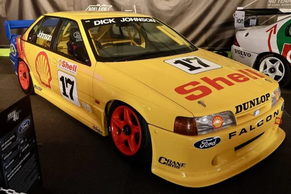 The yellow Shell-liveried Dick Johnson Racing Ford EB Falcon, number 17 with red wheels and DICK JOHNSON across the roof rail, displayed at the 2025 Adelaide Grand Final.