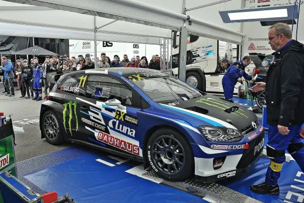 Petter Solberg’s number 11 PSRX Volkswagen Sweden Polo GTI Supercar in the team awning at the 2017 World RX of Barcelona, mechanics and spectators around it