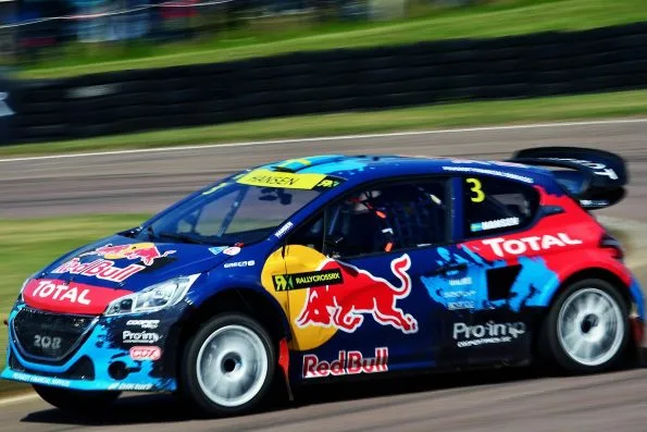 Hansen’s Peugeot 208 T16 rallycross Supercar in Red Bull and Total colours at Lydden Hill during the inaugural World Rallycross season in 2014