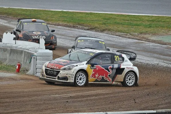 Hansen’s number 21 Peugeot 208 WRX, white with Red Bull and Total graphics, on the gravel section at the 2017 World RX of Barcelona